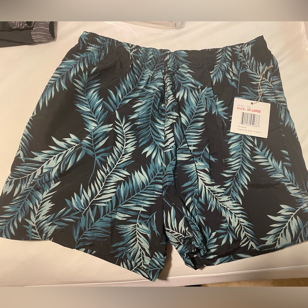 NWT!   Men’s swim trunks black with green fronds.   Size XXL